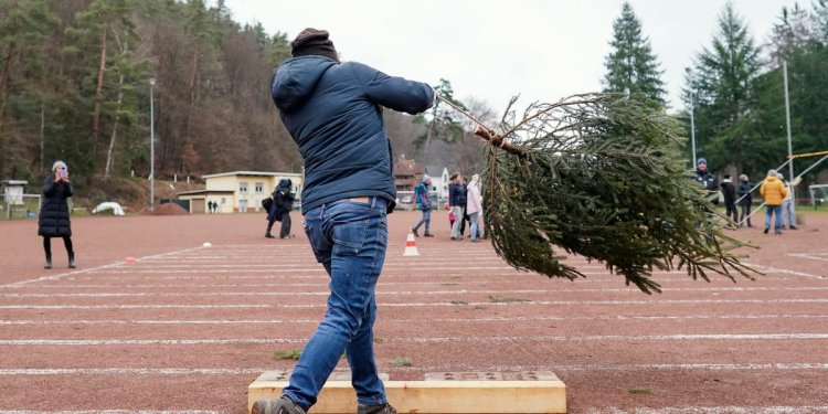 A woman lost her $823,000 injury claim after lawyers found a photo of her winning a Christmas-tree-throwing competition