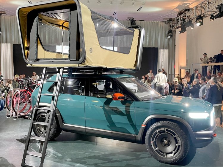 Rivian’s new ‘treehouse’ rooftop tent comes with a movie projector