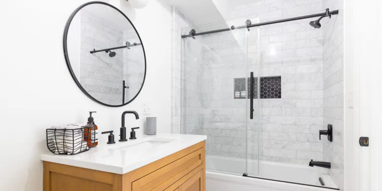 10 tricks to make your bathroom look and feel bigger, according to interior designers